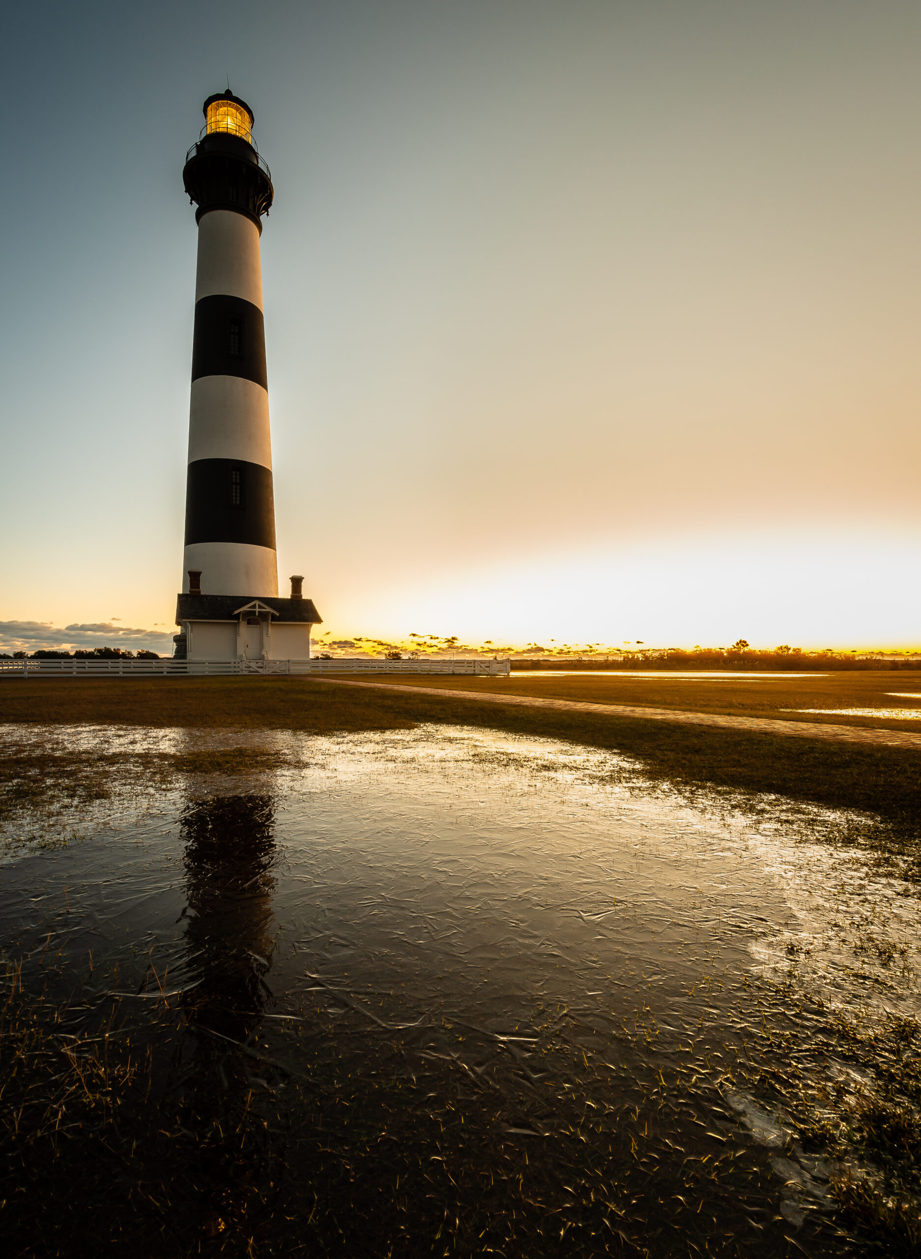 image: lighthouse in the sunset.